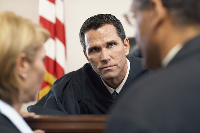 Judge Listening to Attorney --- Image by © Tim Pannell/Corbis